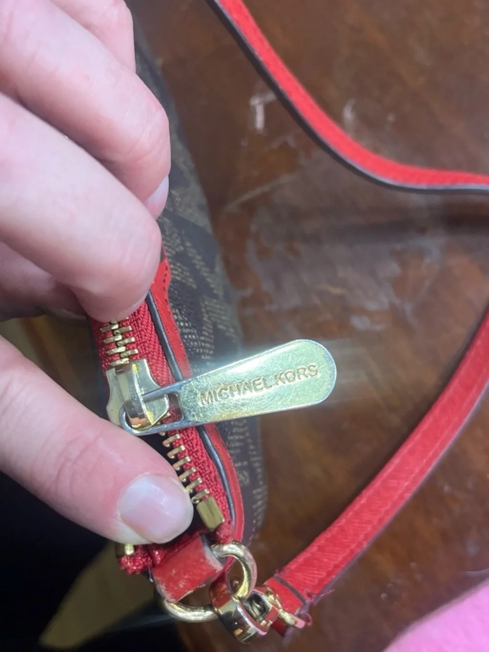 Michael Kors Brown Monogram Wristlet with Red Trim